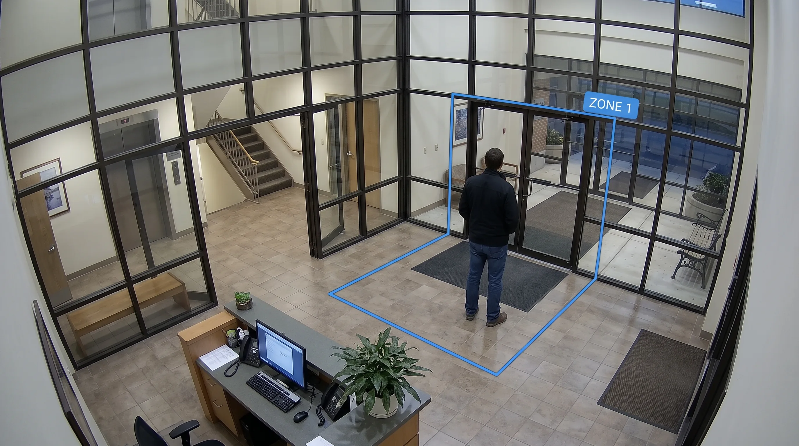 AI tracking how long a person has remained inside a defined monitoring zone on a CCTV feed