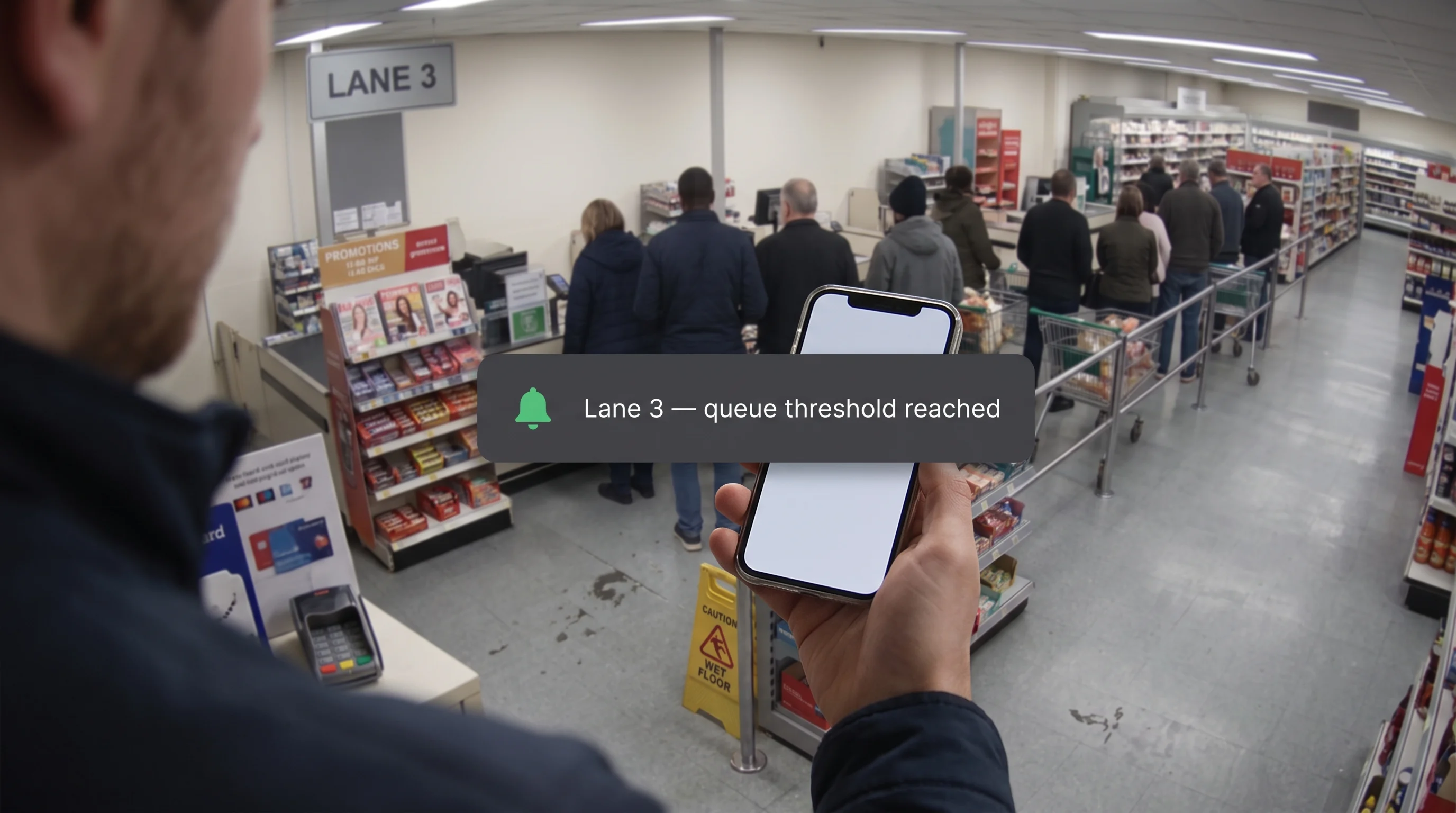 Queue threshold alert notifying a duty manager when a checkout line crosses its set limit